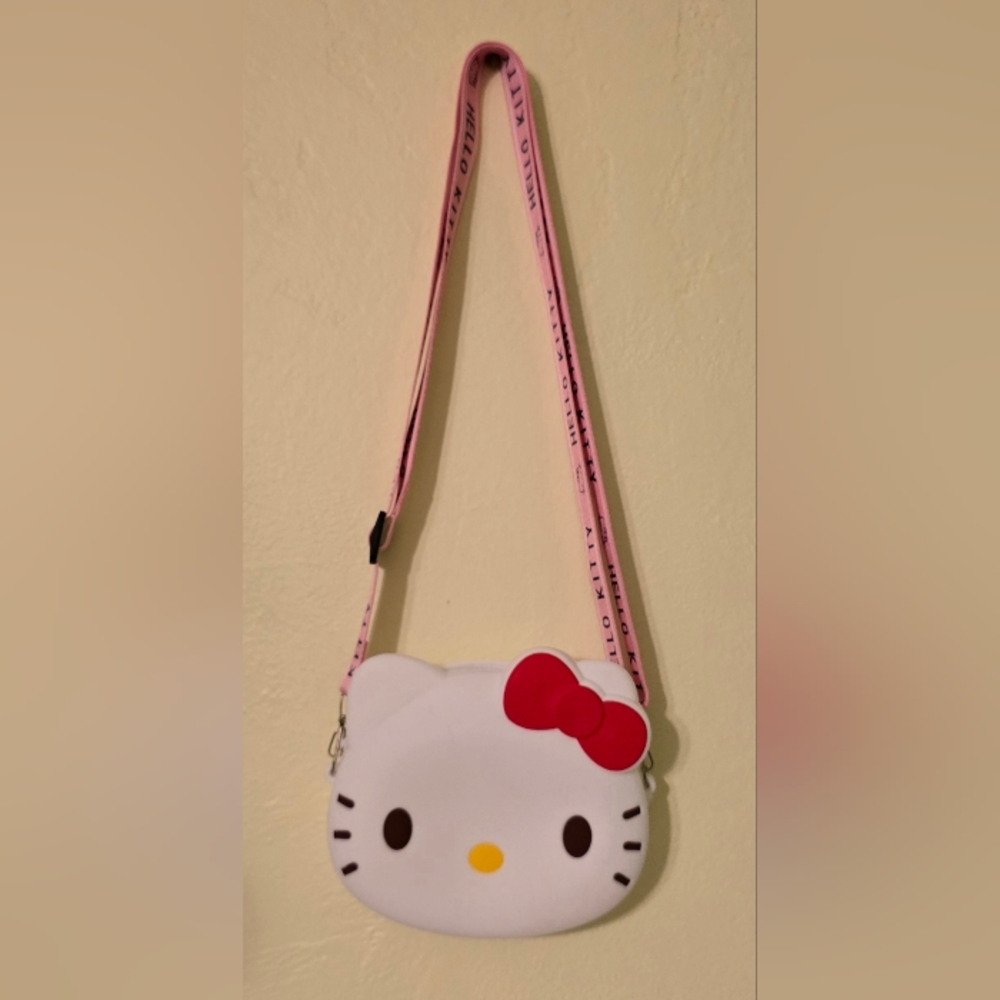 NWT Sanrio Hello Kitty Face Adjustable Crossbody Bag with Pink Strap and Red Bow